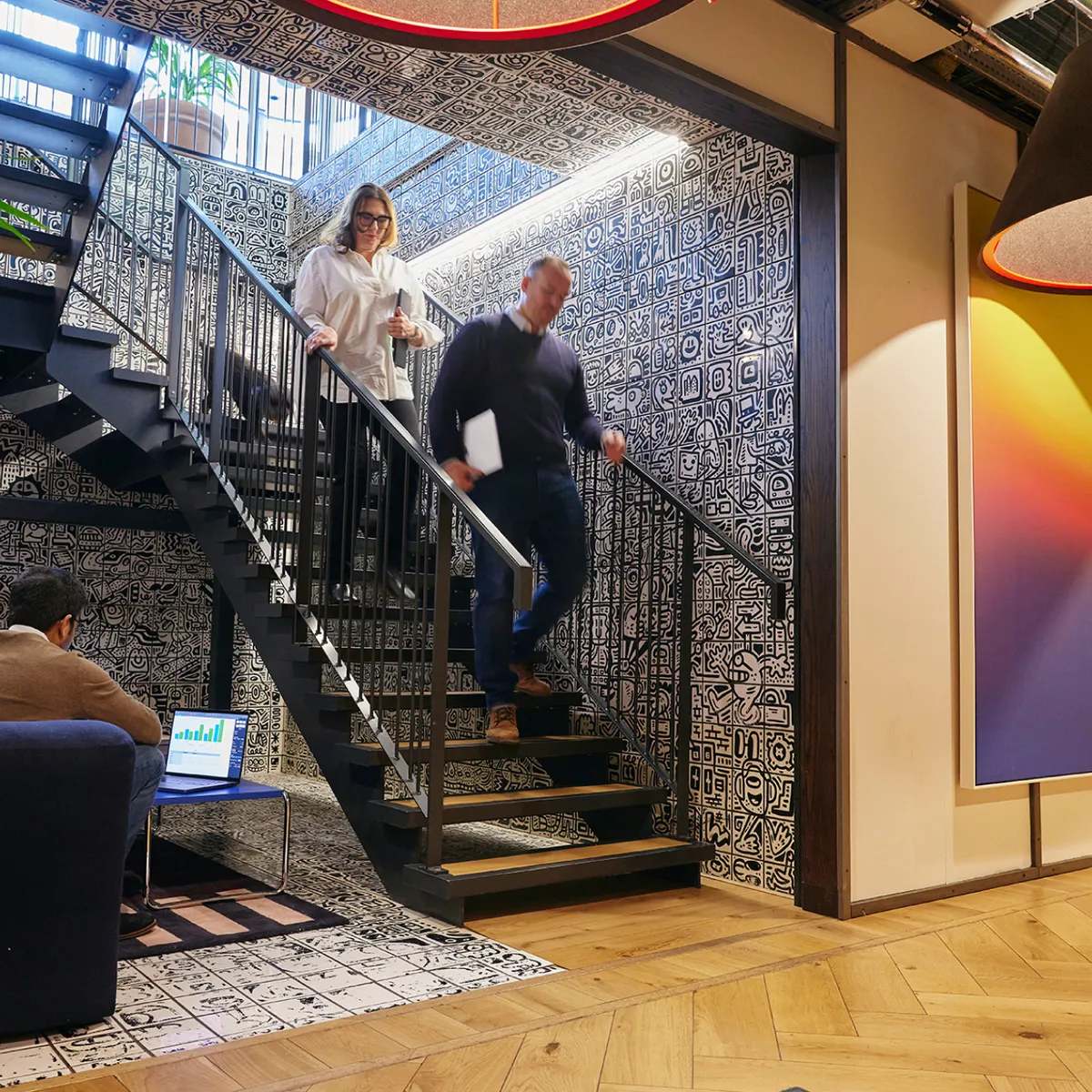 Walking down stairs man and woman | Manage Services